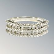 A 9 carat white gold diamond half eternity ring