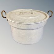 An aluminium twin-handled catering pot with lid