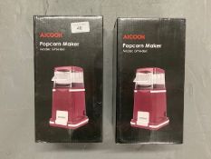Two Alcook popcorn makers