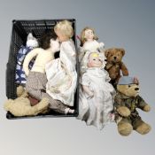 A crate containing assorted porcelain-headed dolls and teddy bears.