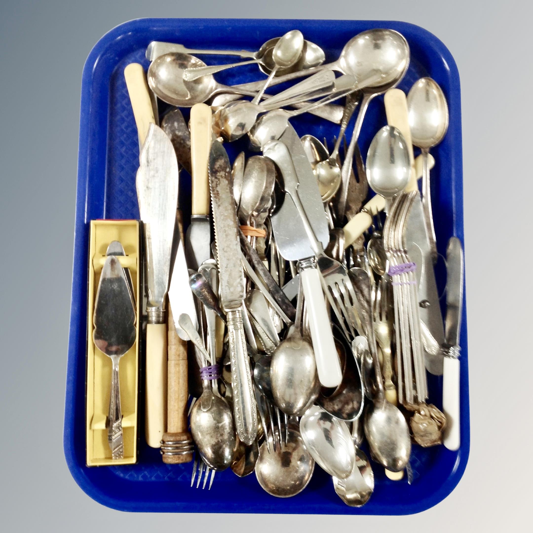 A tray of assorted plated and stainless steel cutlery.