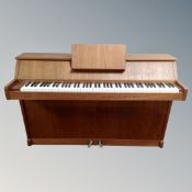 A Hornung and Moller mini piano in teak case,