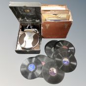 A HMV portable table top gramophone together with a case containing 78s.