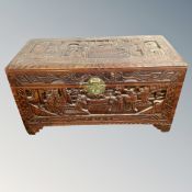 A heavily carved camphor wood box,