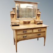 An oak Arts and Crafts dressing chest,