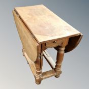 A 19th century oak gate leg occasional table.