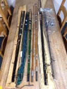 Six assorted vintage and later two-piece fishing rods, one with reel,