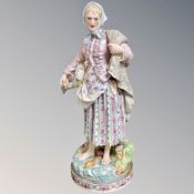 A late 19th century Continental figure - Fisher woman, height 45 cm.