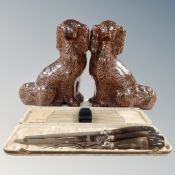 A pair of salt glazed Staffordshire dogs together with a three piece carving set.