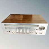 An Akai stereo receiver AA-1040 together with an Akai Custom Deck X-200D