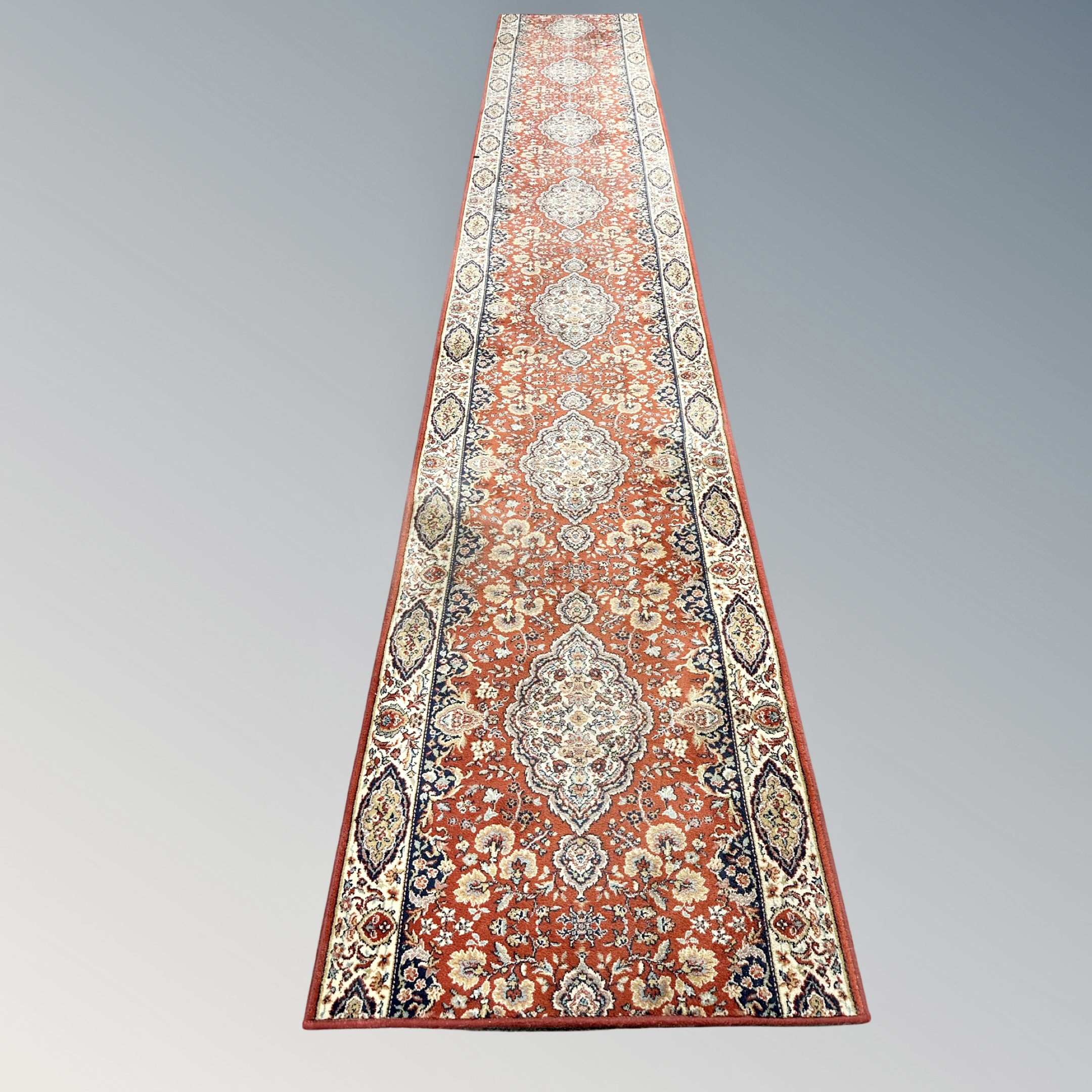 A machine made Persian designed runner 550 cm x 90 cm