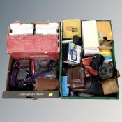 Two boxes containing vintage cameras, photographic equipment, a Eumig projector, Garmin satnav etc.