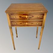A Victorian style two drawer occasional table on raised legs.