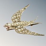 A gold and seed pearl swallow brooch, length 29mm. CONDITION REPORT: 3.3g.