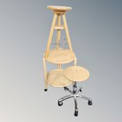 A pine adjustable stool together with a further gas lift stool and a two-tier serving trolley.