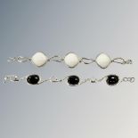 A silver and black onyx bracelet, length 19cm, and one other similar.