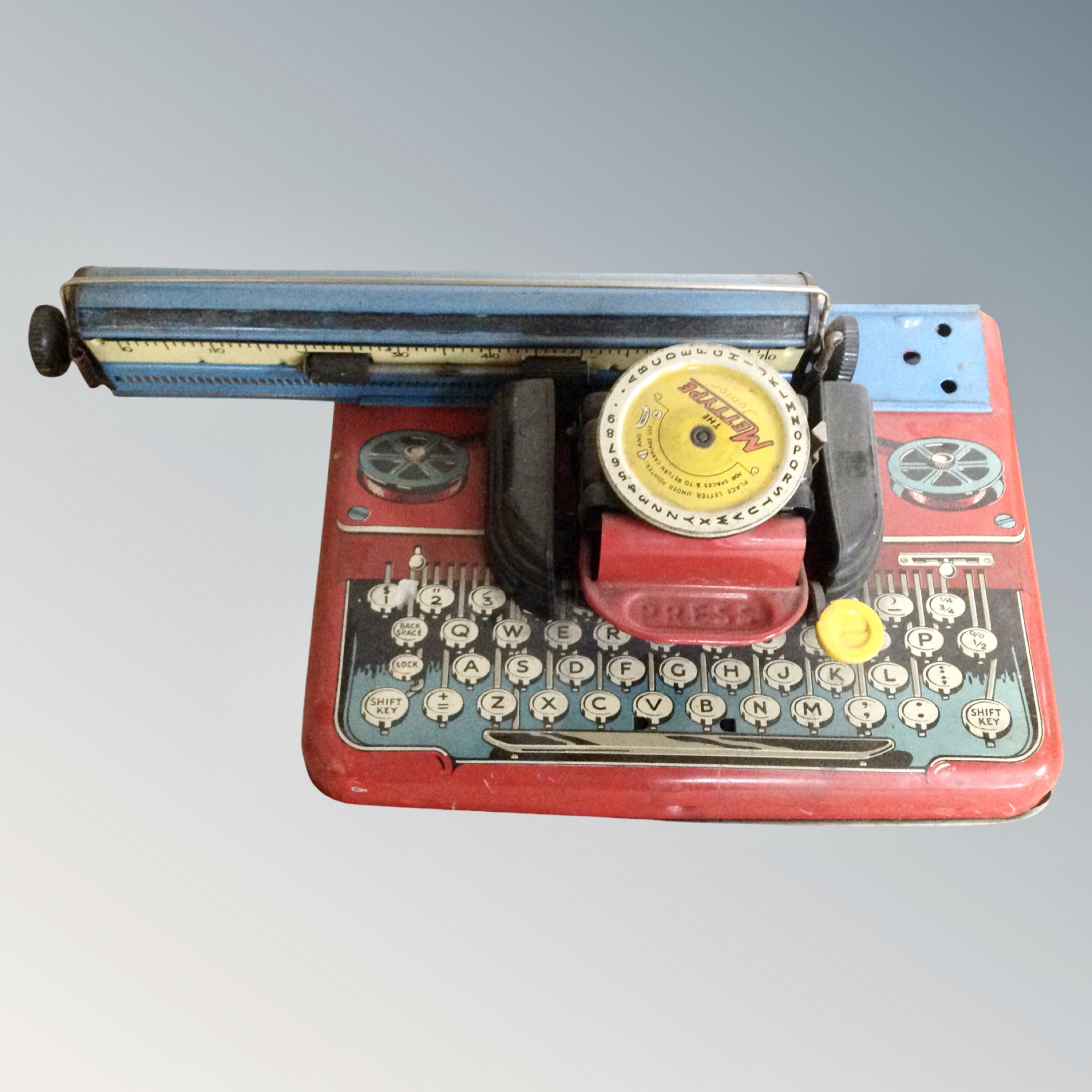 A mid century Mettype junior tin plated toy typewriter