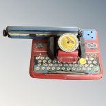 A mid century Mettype junior tin plated toy typewriter