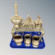 A tray containing Indian engraved brass vase, brass footman, tankards, trivet.