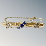A 9ct gold sapphire and seed pearl bar brooch, with safety chain, length 44mm.