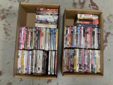 Two boxes of DVDs - approximately 100.