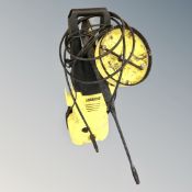 A Karcher K2 pressure washer with accessories.