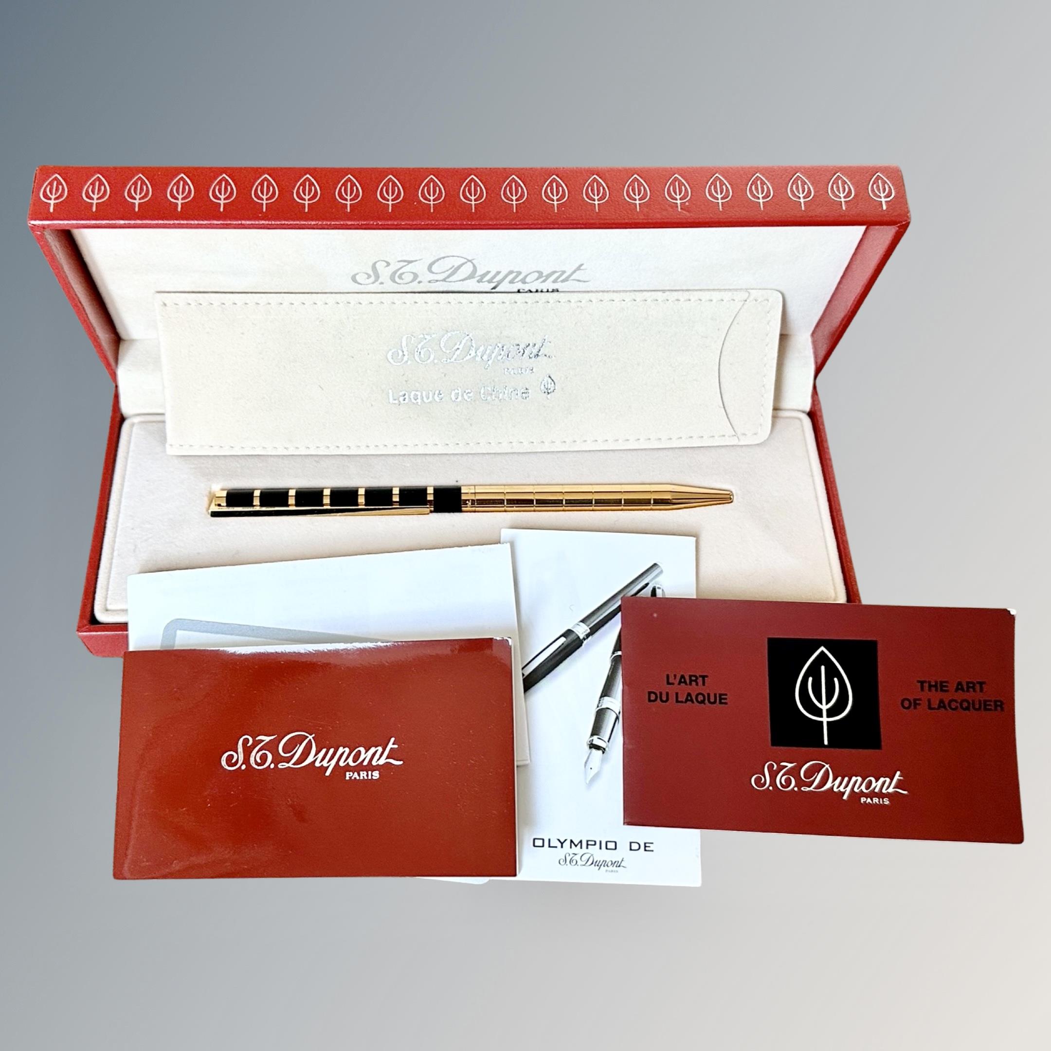 A Dupont Paris gold-plated and enamel ball-point pen, boxed.