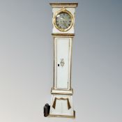 A Danish painted and gilt longcase clock with circular dial, pendulum and weights.