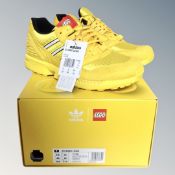 A pair of Adidas ZX8000 lego original trainers, size 10, yellow, as new in box.