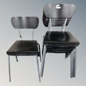 A set of six 20th century stacking school chairs on metal legs.