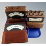 Three vintage volt meters.