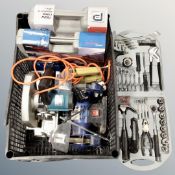 A crate containing cased and uncased power tools to include performance hammer drill,