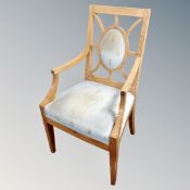 A beech framed armchair in blue upholstery
