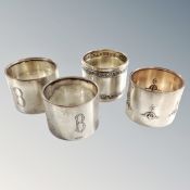 Four silver napkin rings, stamped 800.