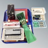 A tray containing stylophone, boxed camera, Etch A sketch, darts etc.
