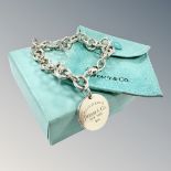 A Tiffany & Co silver bracelet with fob, boxed. CONDITION REPORT: 36.