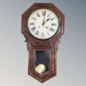 An antique oak cased drop dial wall clock.