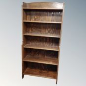 A pair of early 20th century oak waterfall bookshelves,