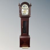 A contemporary moonphase longcase clock with pendulum and weights