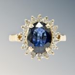 An 18ct yellow gold sapphire and diamond cluster ring, size M/N, 5.1g.