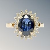 An 18ct yellow gold sapphire and diamond cluster ring, size M/N, 5.1g.