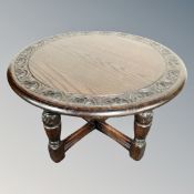 A Jaycee oak circular occasional table.