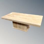 A travertine pedestal coffee table,