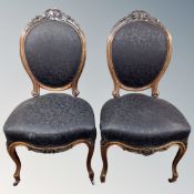 A pair of Victorian rosewood framed oval backed salon chairs.