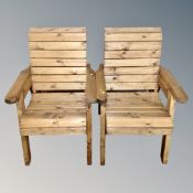 A three-piece pine wooden slatted garden set to include bench and two armchairs