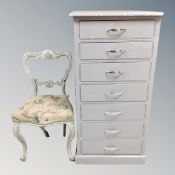 A 20th century painted pine narrow seven drawer chest together with a painted French occasional