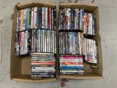 Two boxes of DVDs - approximately 100.