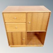 A 20th century Scandinavian cube shelving unit, fitted cupboards and drawers.