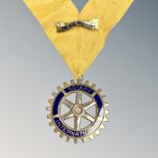 A Rotary club medal on ribbon
