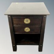 A Chinese style two drawer bedside table.